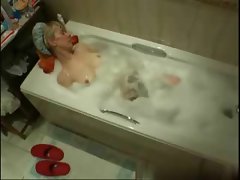My mum masturbating in bath tube caught by hidden cam