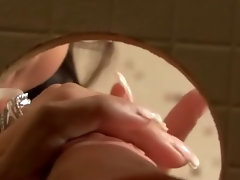 Classy babe sucks and rubs the gloryhole