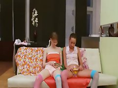 Two polish chicks play with strong man