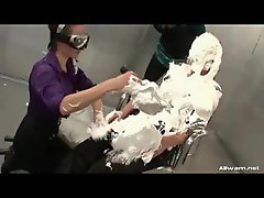Girl blindfolded and covered in cream